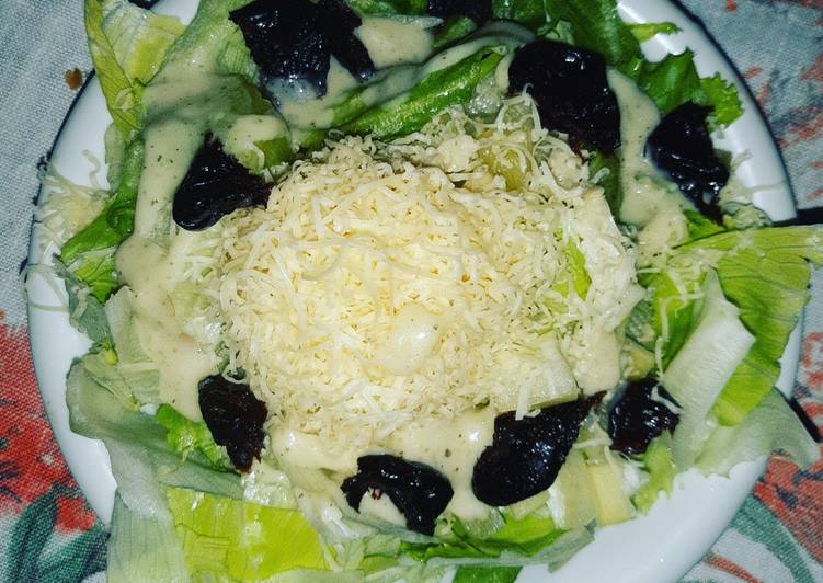 Salad with Cezarian Dressing,Cheese and Dried Plums Salad with Cezarian Dressing,Cheese and Dried Plums