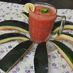 A picture of Watermelon 🍉 lemon 🍋 mint leaves juice.