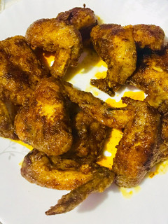 A picture of Chicken wings with spiced melted butter glaze.