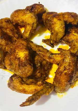 A picture of Chicken wings with spiced melted butter glaze.