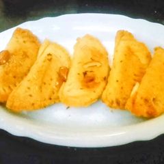 A picture of Baked Almond Ghujia.