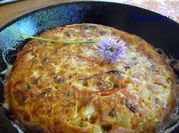 Una foto de tortilla de pimientos morrones