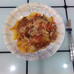 A picture of French fries with tomato omelette.