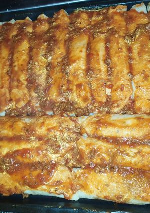 Una foto de Canelones de ricota, espinaca, jamón y queso 🌯😉