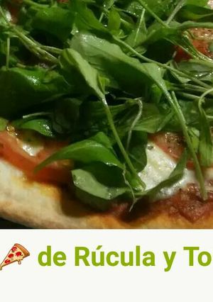 Una foto de Pizza de Rúcula y Tomate