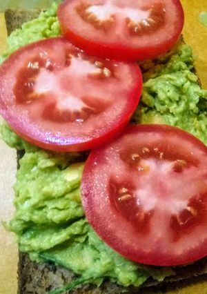 A picture of Garbanzo Avocado open Faced sandwich.