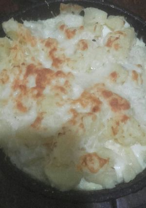 Una foto de Papas a los 4 quesos con crema