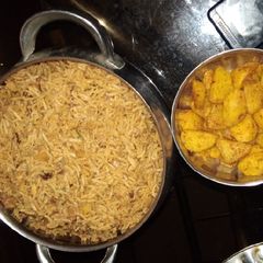A picture of Brown rice and fried potatoes.