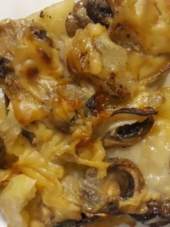 Una foto de Papas con champiñones al horno
