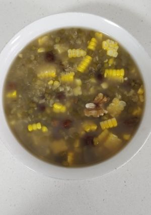 A picture of Corn and Mung Bean Soup with Raisins and Walnuts.