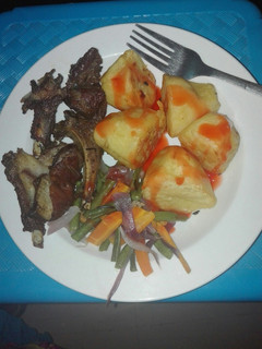 A picture of Pan grilled mutton ribs, Roasted potatoes with veggies.
