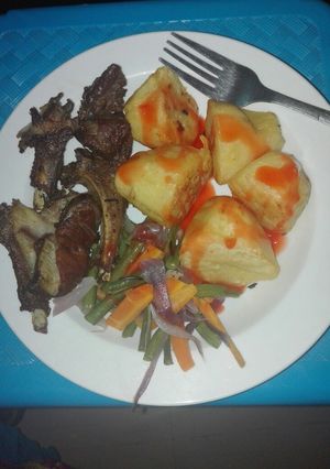 A picture of Pan grilled mutton ribs, Roasted potatoes with veggies.