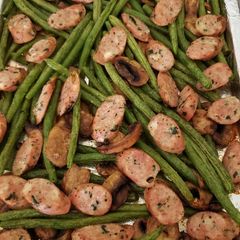 A picture of Sheet pan sausage and green beans.