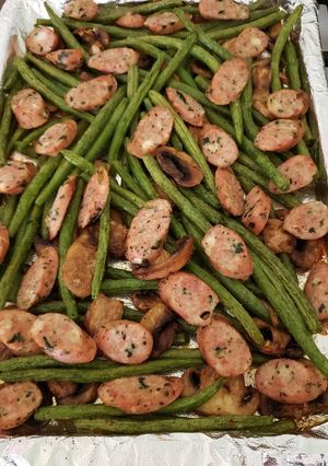 A picture of Sheet pan sausage and green beans.