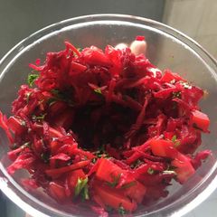 A picture of Shredded carrot, beet & pomegranate salad.