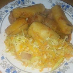 Matoke with steamed cabbage A picture of Matoke with steamed cabbage.