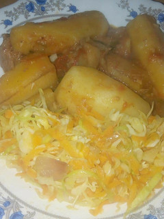 A picture of Matoke with steamed cabbage.