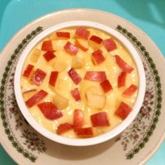 A picture of Custard with apple cubes 🍎🍏🍎.