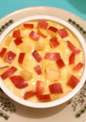 A picture of Custard with apple cubes 🍎🍏🍎.