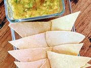 A picture of nachos with tomato salsa