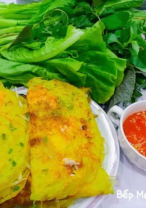 A picture of Bánh xèo with Shrimp, Pork, Squid, and Quail Eggs.