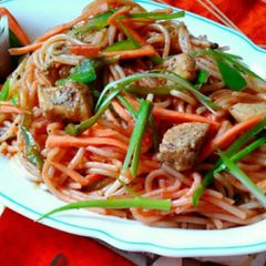 A picture of Chicken colorful spaghetti.