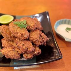 Cauliflower and cumin fritters with mint yoghurt A picture of Cauliflower and cumin fritters with mint yoghurt.