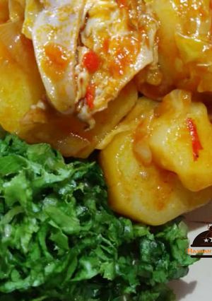A picture of Potatoes jollof with lettuce.