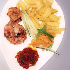 A picture of Irish potatoes,prawns and pepper sauce.