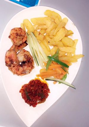 A picture of Irish potatoes,prawns and pepper sauce.