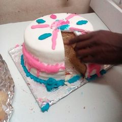 A picture of My strawberry cake with fodant icing.