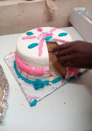 A picture of My strawberry cake with fodant icing.