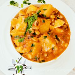 A picture of Yam and beans porridge with moringa.