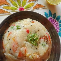 A picture of Veggie Upma with Lemon.