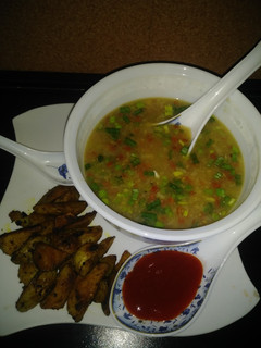 A picture of Sweet corn veg soup with roasted potatoes.
