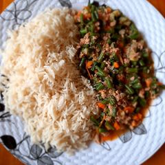 A picture of White rice with french beans stew.