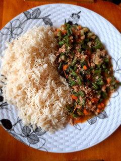 A picture of White rice with french beans stew.