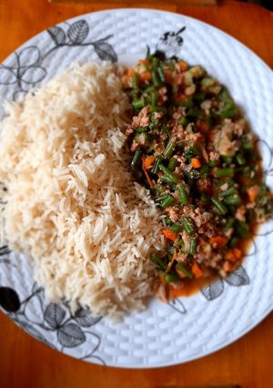 A picture of White rice with french beans stew.