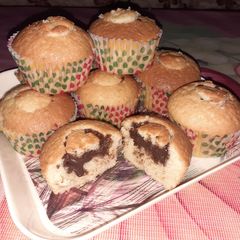 A picture of Chocolate filled vanilla cupcakes.