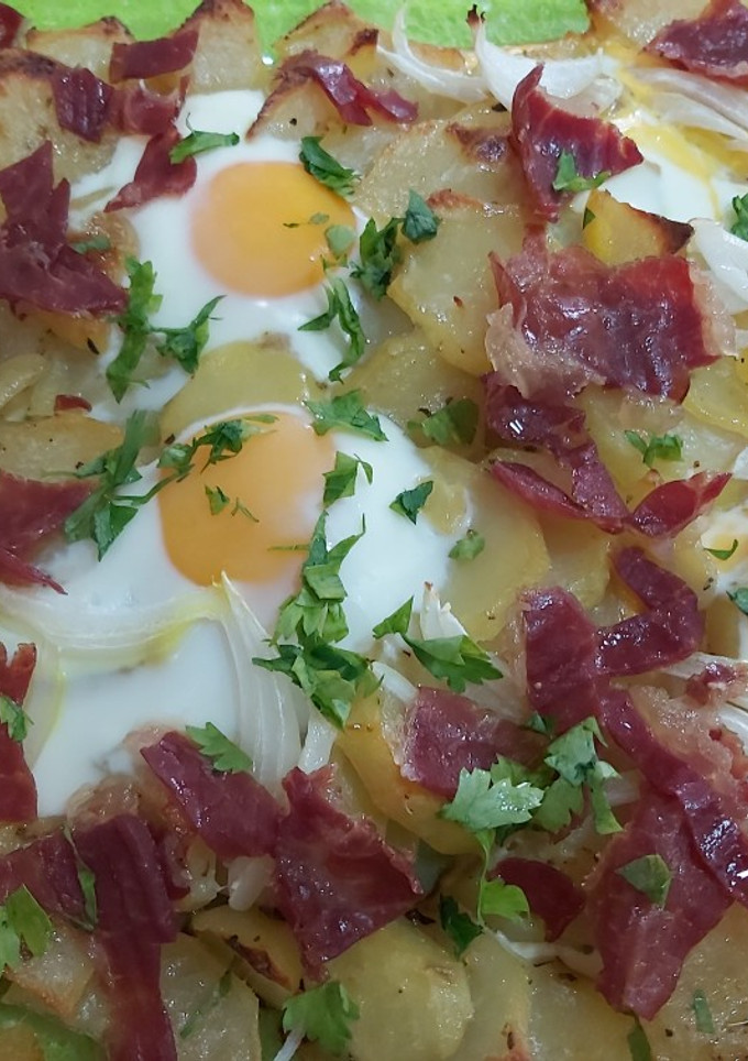 Una foto de Huevos rotos al horno🍳