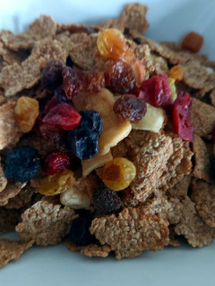 A picture of My Fruit & Fibre Breakfast with added Mixed Berries and Nuts.