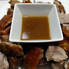 A picture of Pork roast with crispy crackling and apple gravy.