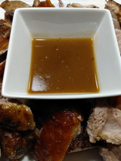A picture of Pork roast with crispy crackling and apple gravy.