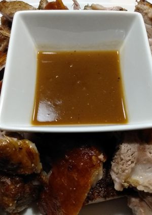 A picture of Pork roast with crispy crackling and apple gravy.