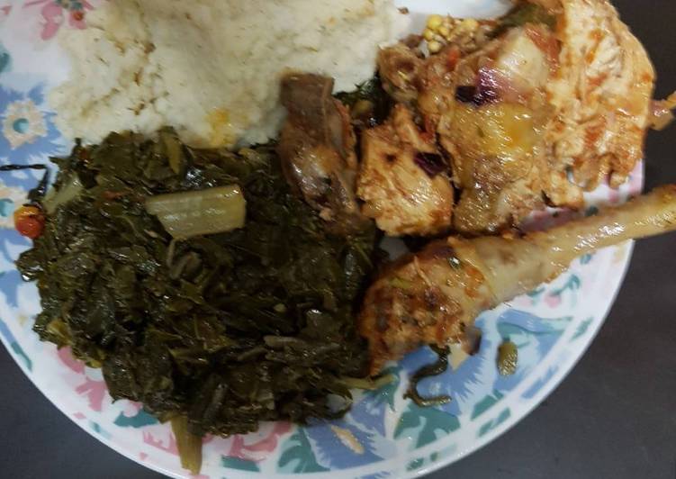 Ugali served with chicken and spinach