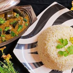 A picture of Masala bengan with zeera Rice.