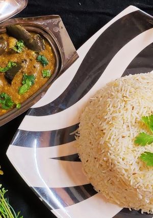 A picture of Masala bengan with zeera Rice.