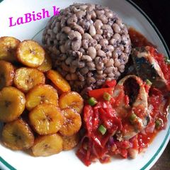 A picture of Beans,fried plantain with egg sauce.