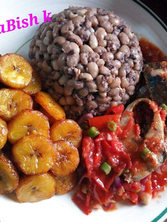 A picture of Beans,fried plantain with egg sauce.