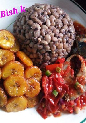 A picture of Beans,fried plantain with egg sauce.